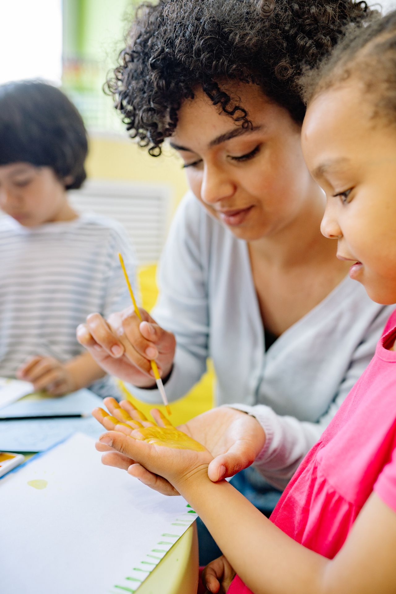 A For Kids' Sake teacher engaging with children